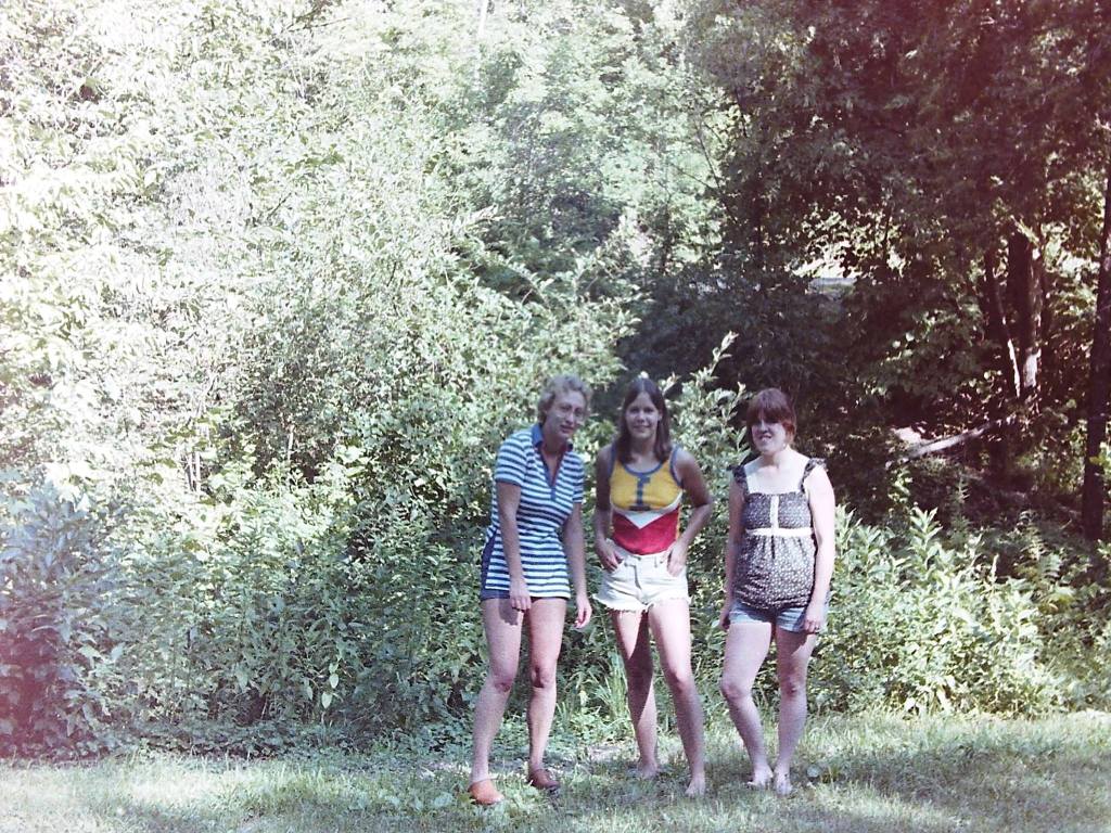 three college friends in a park