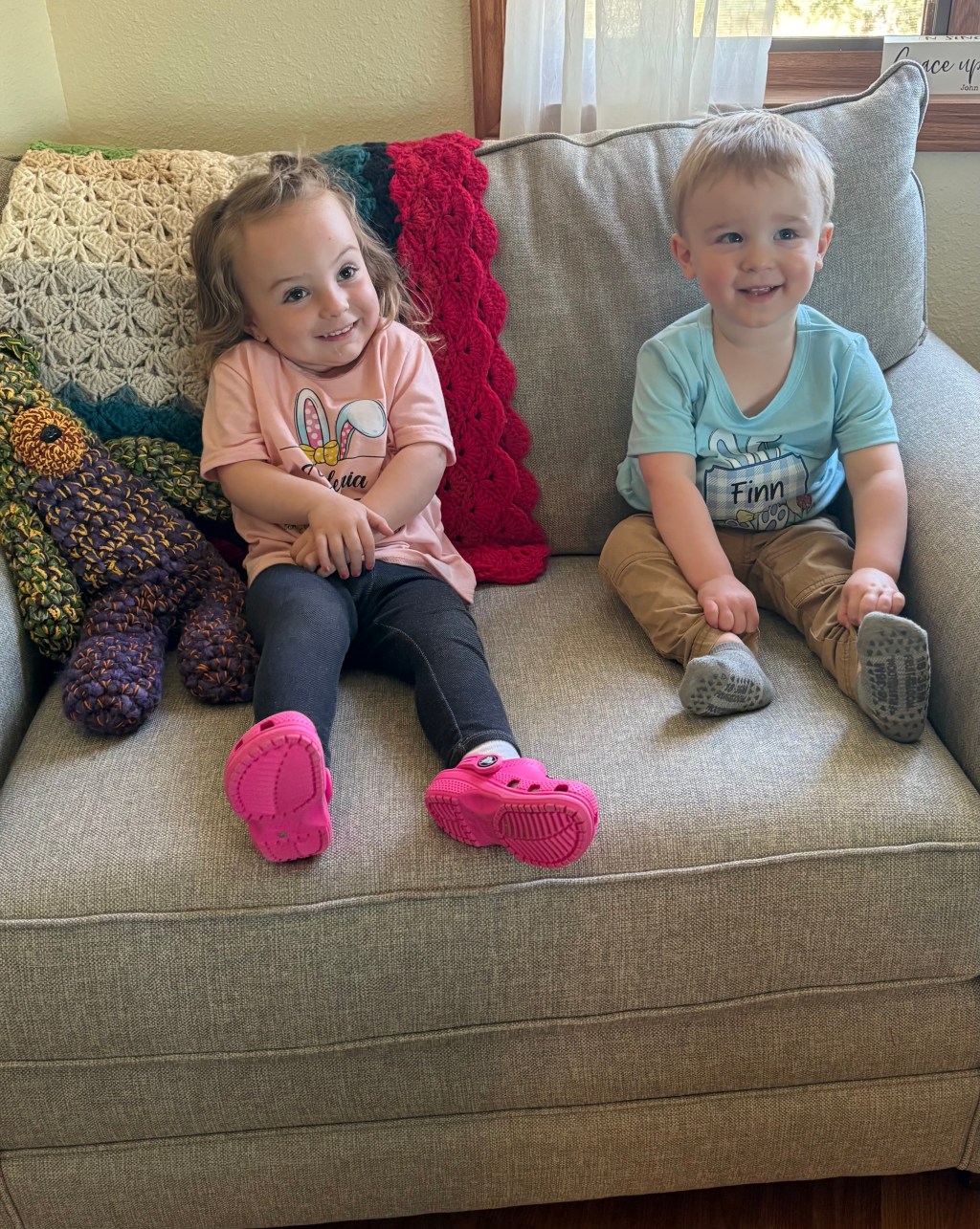 Two little kids on couch