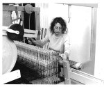 Woman weaving on an AVL loom
